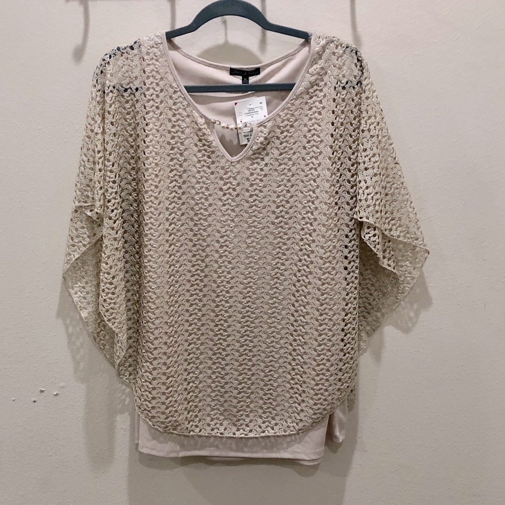 Woman’s Capelet top